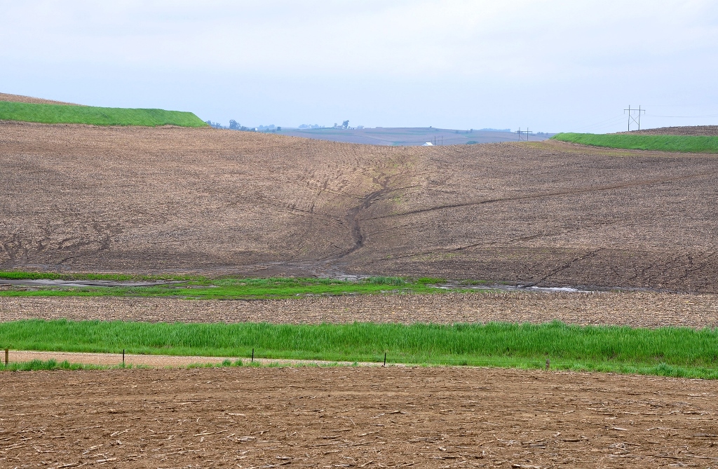 Photo showing soil erosion after five inches or more of rain fell in one hour across portions of Western Iowa in 2013.  Photo credit USDA NRCS. 