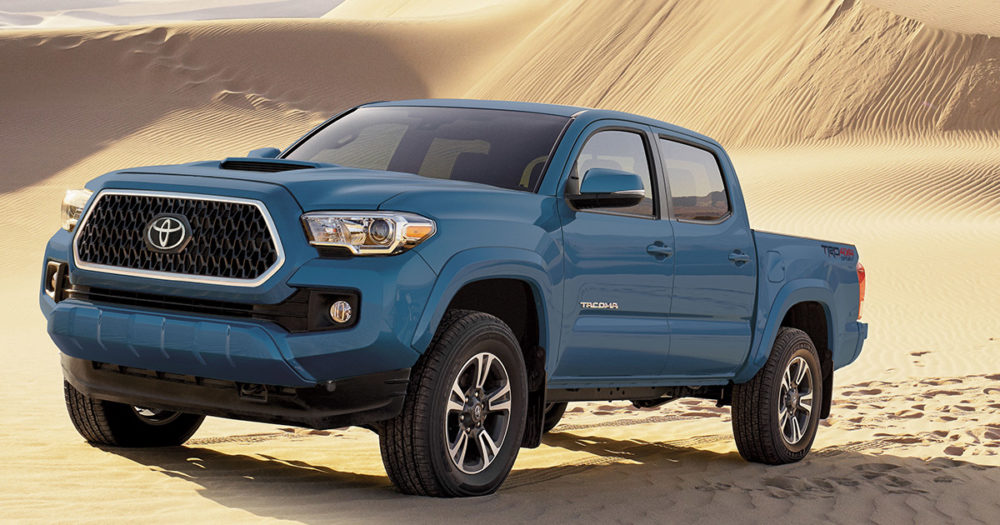 2019 Blue Toyota Tacoma Sport in sand dune