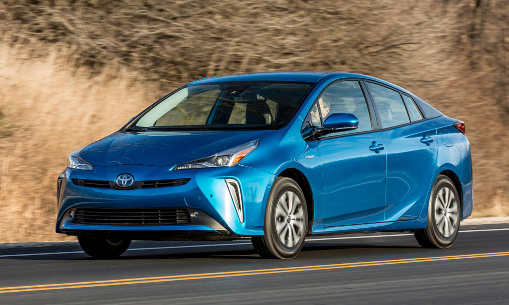 A blue 2020 Toyota Prius on a back road