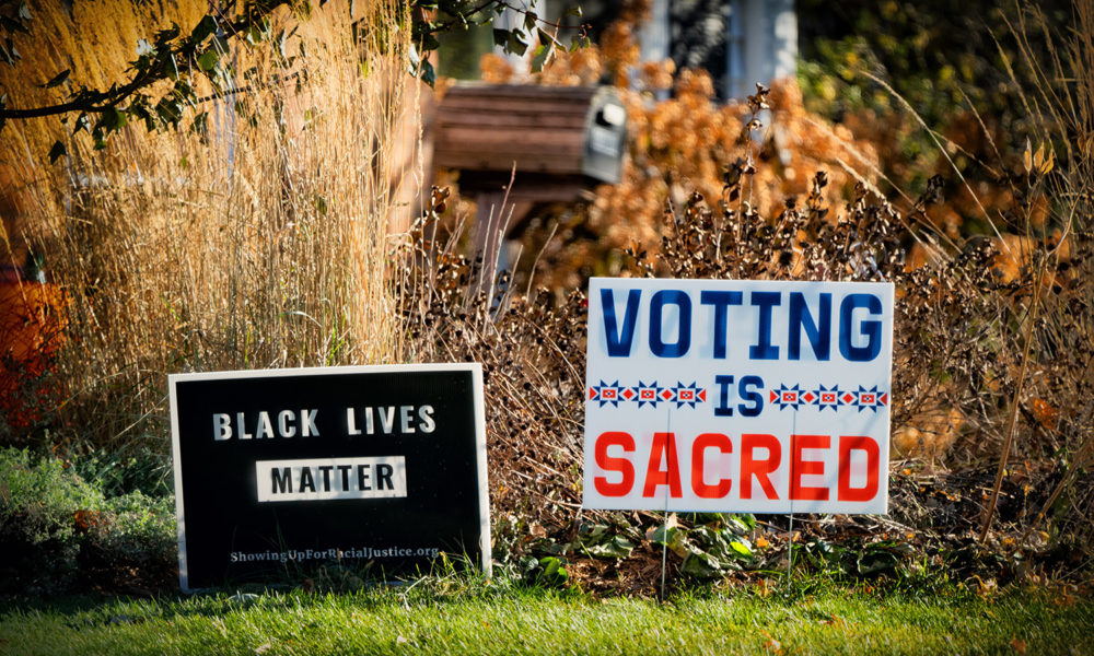 Signs outside a Minnesota home saying Black Lives Matter and Voting Is Sacred