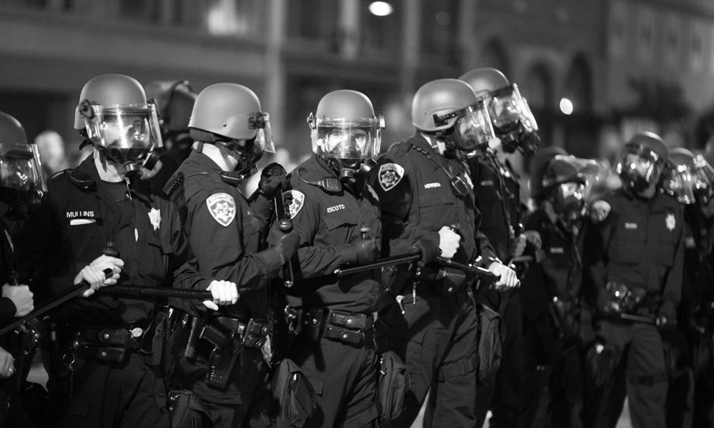 riot police with gas masks during the Oakland, CA protests in 2010