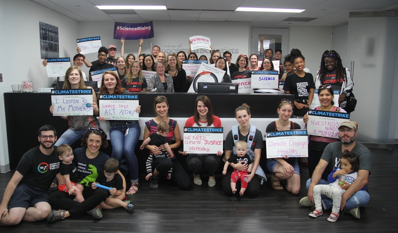 A group of UCS staff and their families pose in the UCS office in Washington, DC, before the Climate Strike in 2019.