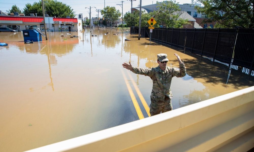 Delaware Army National Guard members provide flood rescue support in Wilmington, Delaware, September 2, 2021, alongside local fire departments and police to assist community members who were stranded after heavy rains drenched the area and covered the roads with standing water, post Hurricane Ida