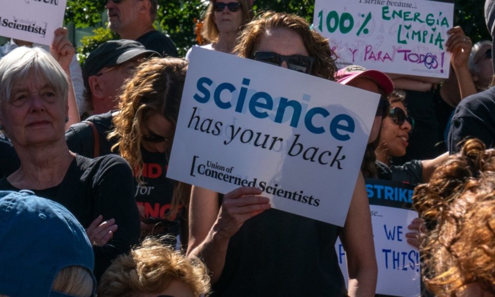 "Science has your back" sign at a protest