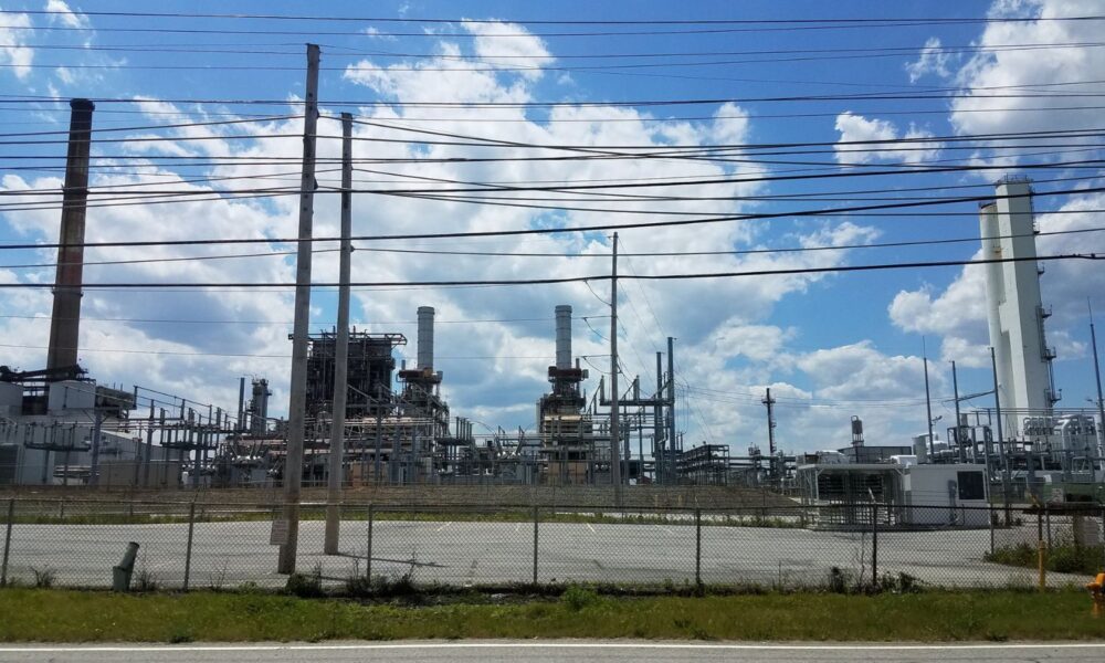 chemical plant behind a fence
