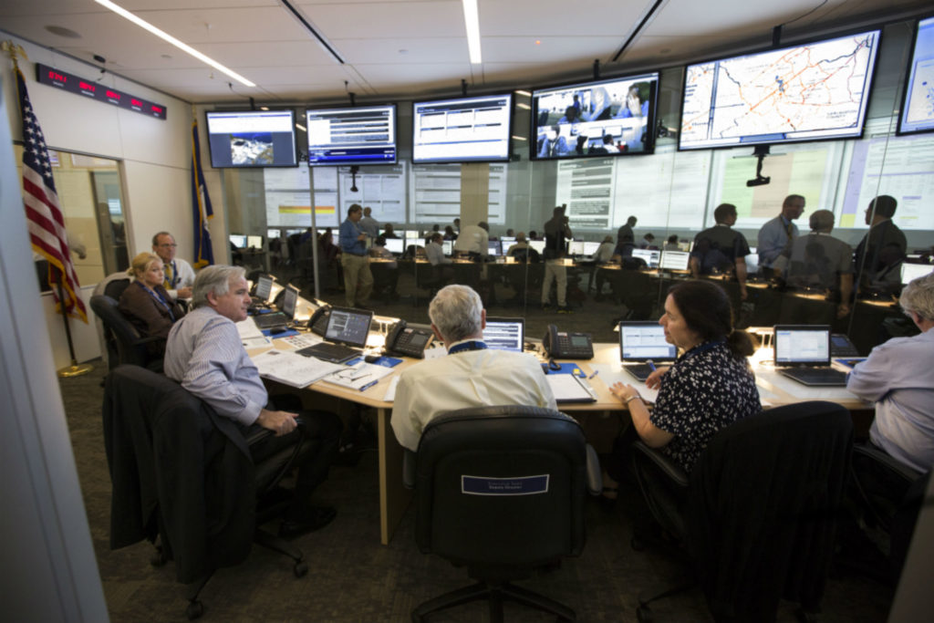 The Incident Response Center during the Southern Exposure exercise conducted for the HB Robinson nuclear plant (SC) in October 2015. The NRC’s Executive Team is in the foreground with senior members of the agency’s reactor, engineering, and security offices. NRC staffers in the background monitor conditions at the plant (Source: 