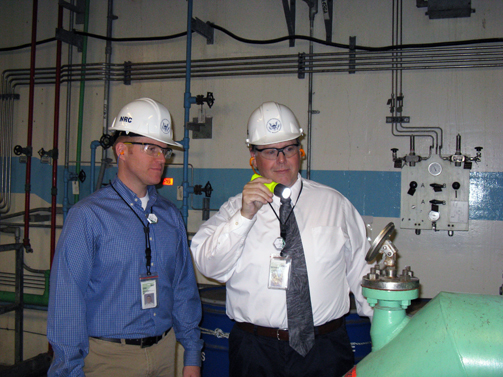 NRC resident inspectors Tony Brown (left) and Michael Peck (right) examining an emergency coolant pump at Diablo Canyon on March 2, 2011. (Source: NRC)