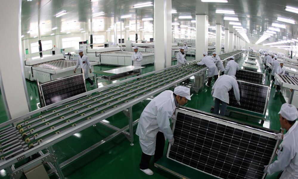 solar panels being manufactured