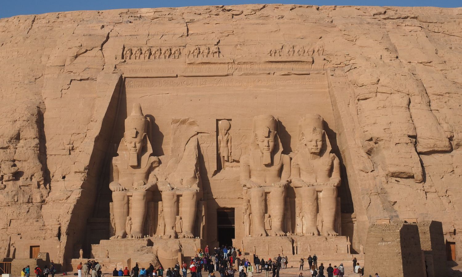 The temples at Abu Simbel in Egypt, shown with a crowd of tourists exploring them