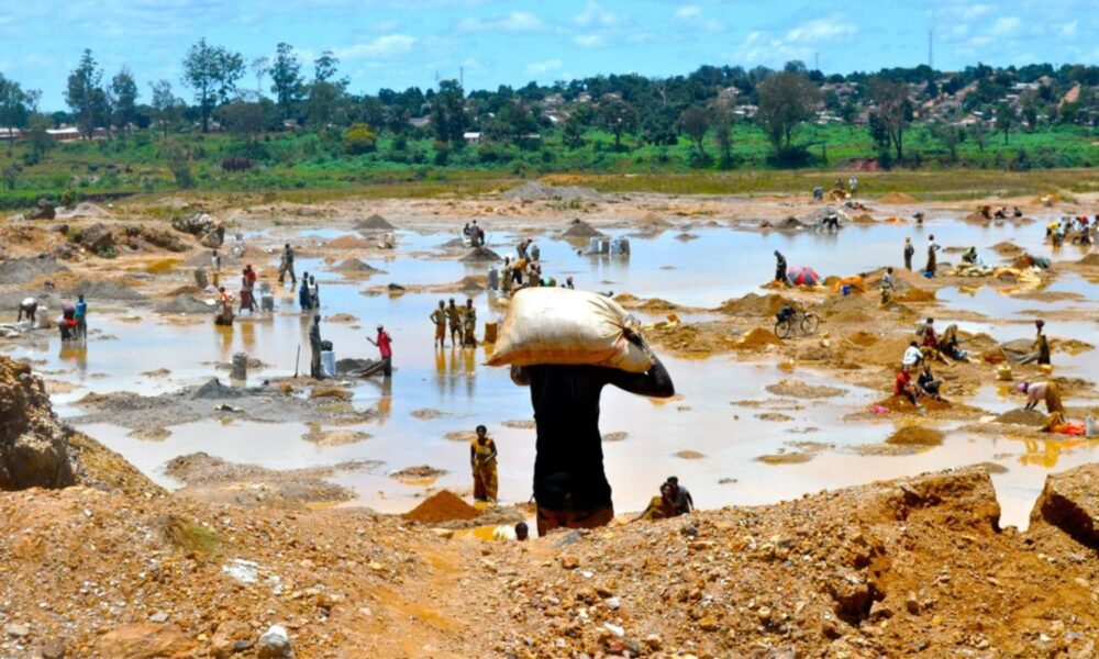 Workers wash copper ore in the Democratic Republic of Congo,