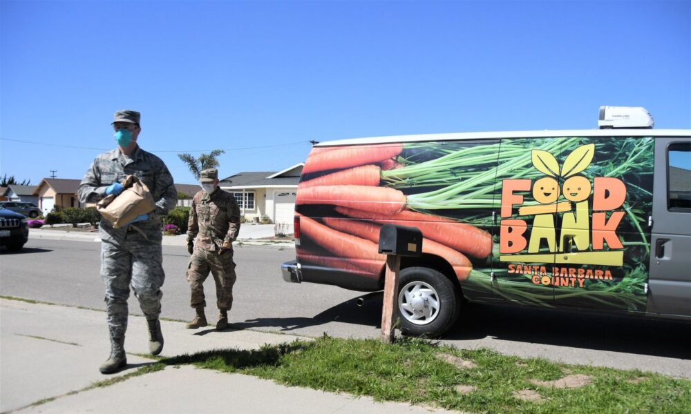 California Air National Guard members deliver food on April 2, 2020, as part of the Cal Guard's COVID-19 humanitarian mission