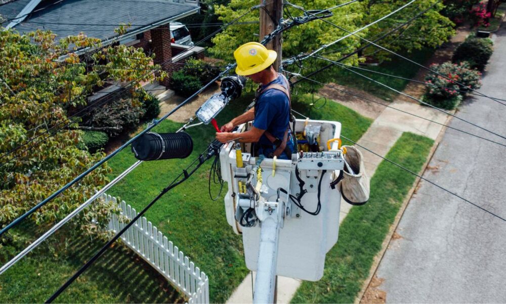 overhead view of man repairing electrical wires