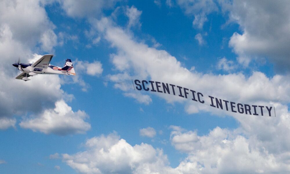 plane with "scientific integrity" banner