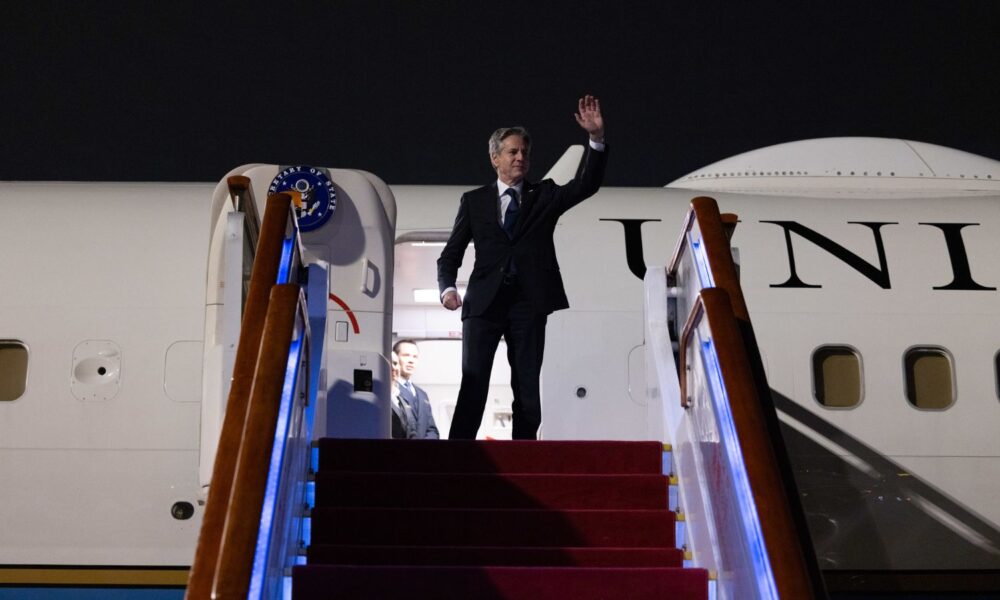 Secretary of State Antony J. Blinken is pictured waving from an airplane as he departs from Beijing, China, on June 19, 2023.
