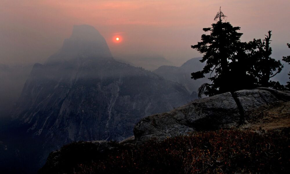 Wildfire smoke obscures an otherwise beautiful view from Yosemite's Half Dome