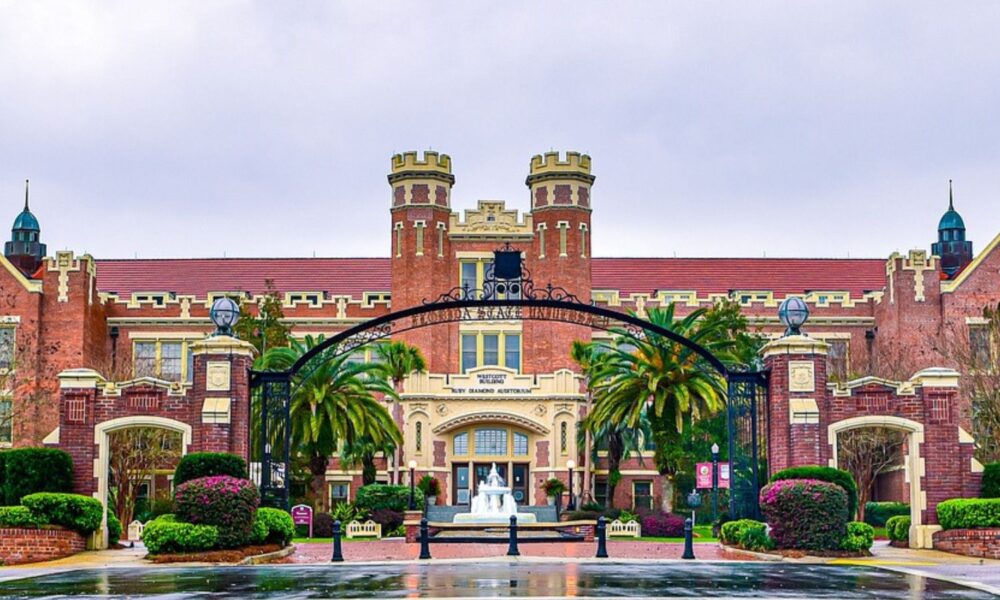 The front of the Westcott Building at Florida State University, featuring a large brick building and a decorative fountain