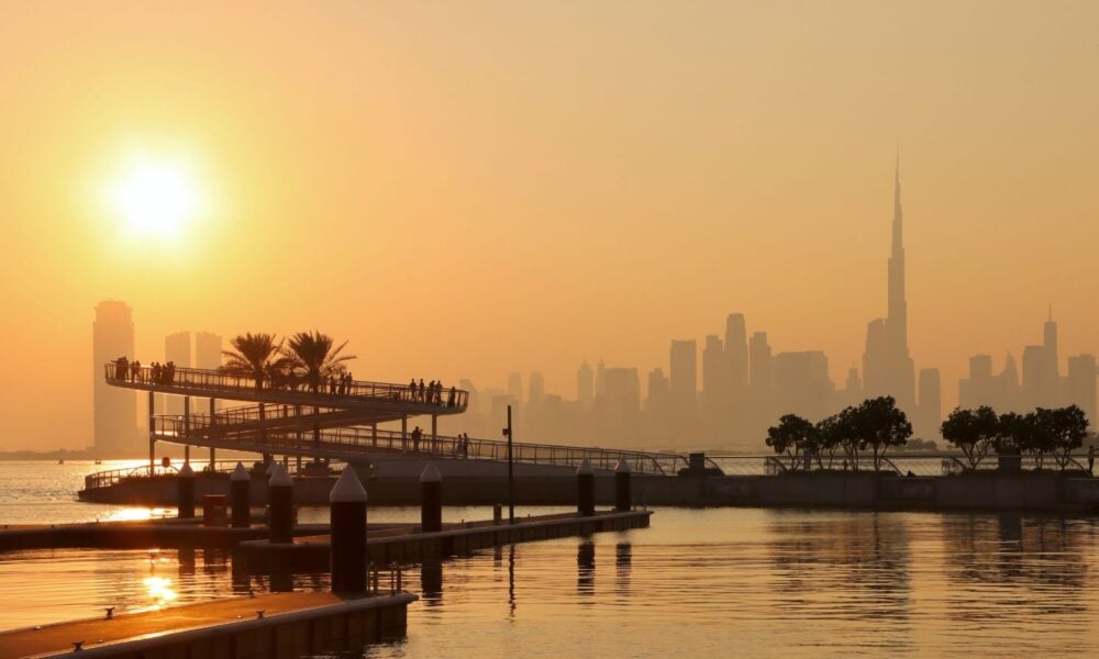 The sun sets over Dubai Creek in Dubai, UAE, location of this year's UN climate convening