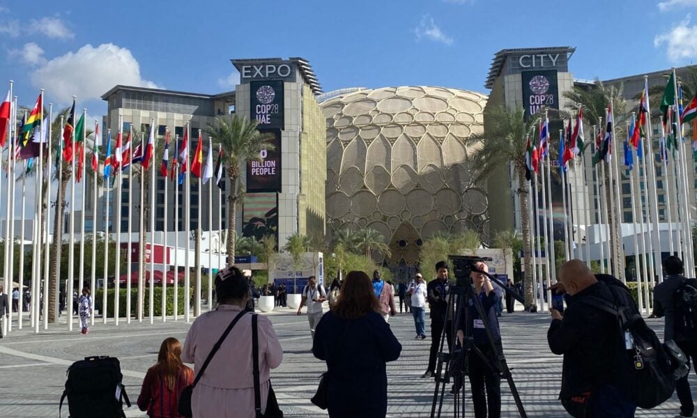 A press conference takes shape outside of Expo City, a COP28 venue in Dubai, UAE.