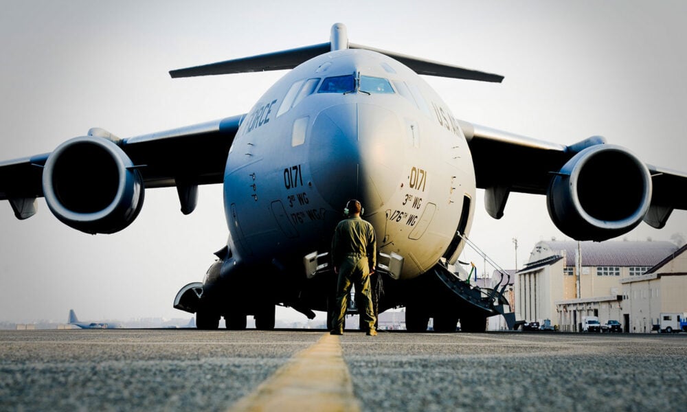 U.S. Air Force Tech. watches a C-17 Globemaster III at Yokota Air Base, Japan.