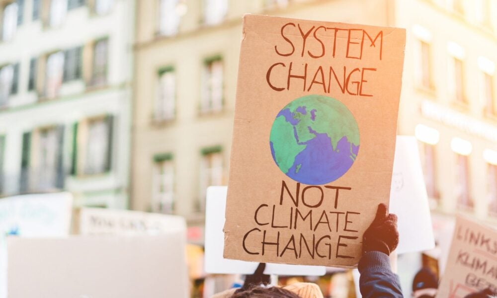 Sign: system change, not climate change