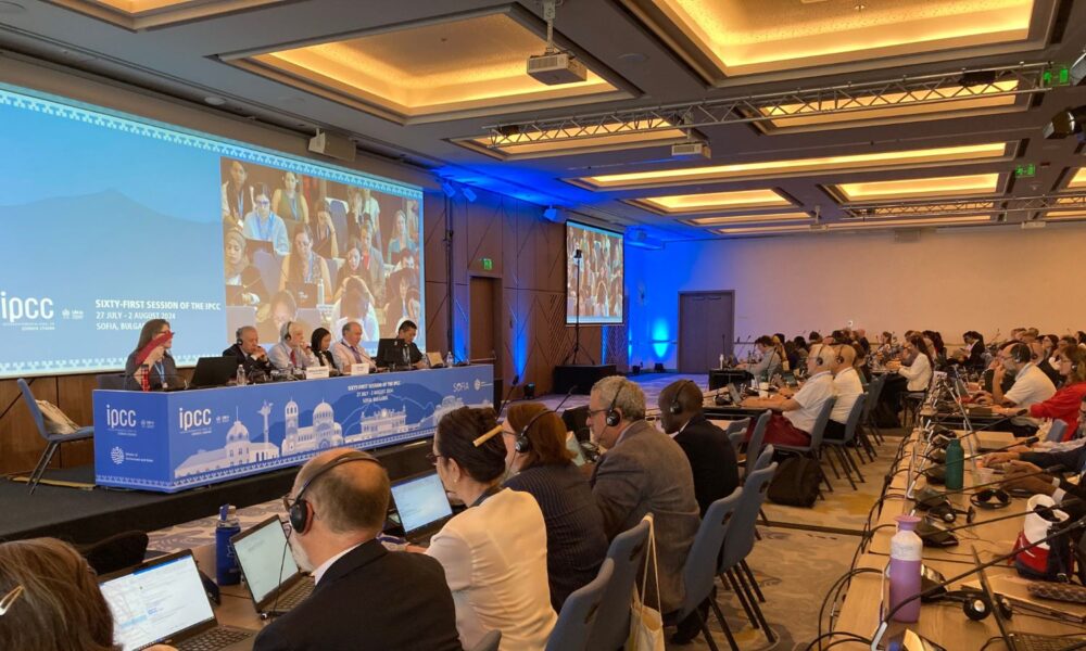 Attendees at the 61st Intergovernmental Panel on Climate Change watch a presentation.