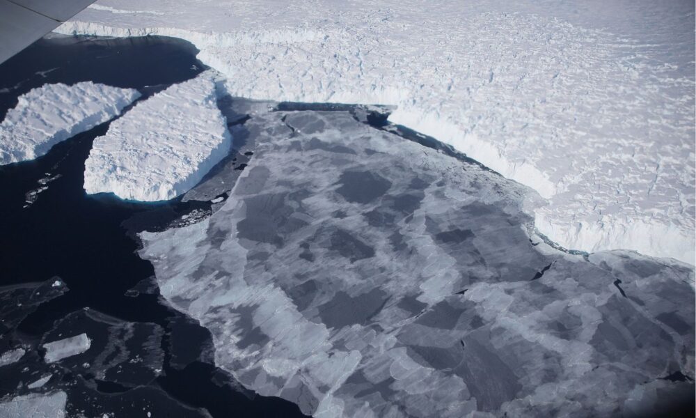 Ice floats near the coast of West Antarctica as viewed from a window of a NASA Operation IceBridge airplane on October 28, 2016, in-flight over Antarctica.