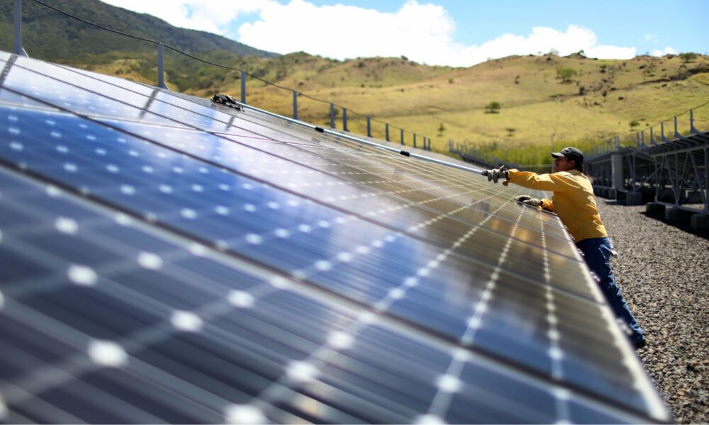 A worker cleans the panels in a solar power park in Guanacaste, Costa Rica.