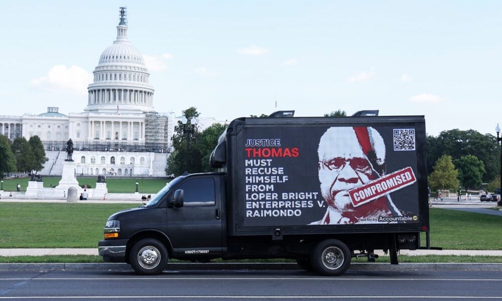 A billboard truck calling for Justice Clarence Thomas to recuse himself in the case that eventually overturned the Chevron Doctrine passes in front of the US Capitol building in 2023, before the case was heard.