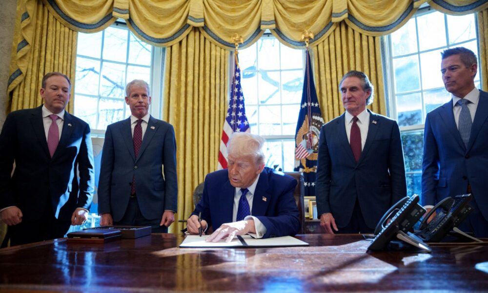 President Trump signs an executive order at the White House.